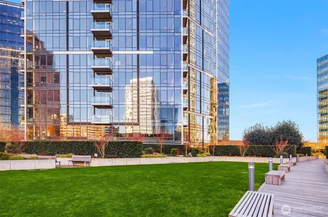 a front view of a building with a yard