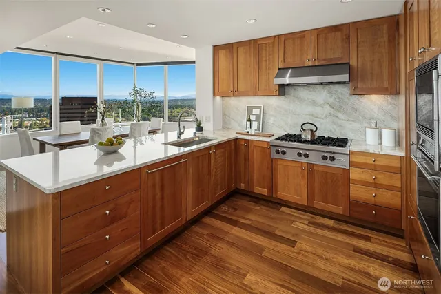 a kitchen with a sink stove and cabinets