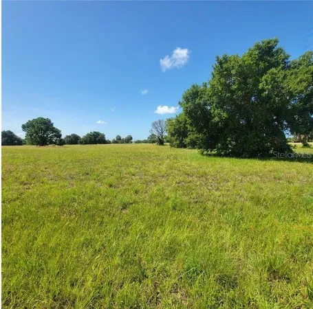 a view of yard with swimming pool and outdoor seating