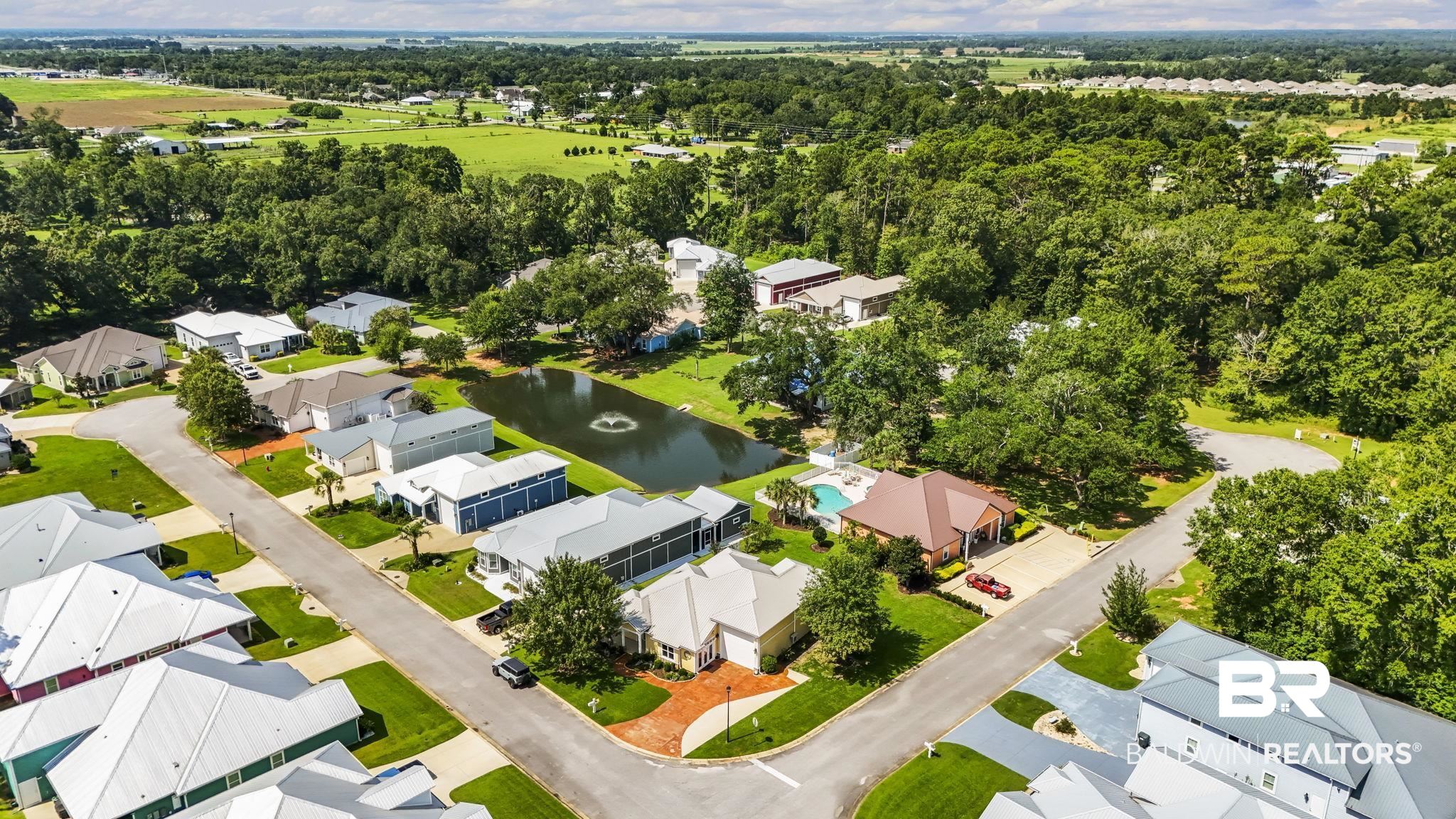 12361 Reunion Place Foley, AL 36535 - Photo 42 of 43 Aerial perspective of suburban area with a large body of water