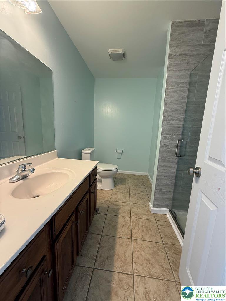 4141 Walter Road Bethlehem, PA 18020 - Photo 16 of 34 a bathroom with a sink and a mirror