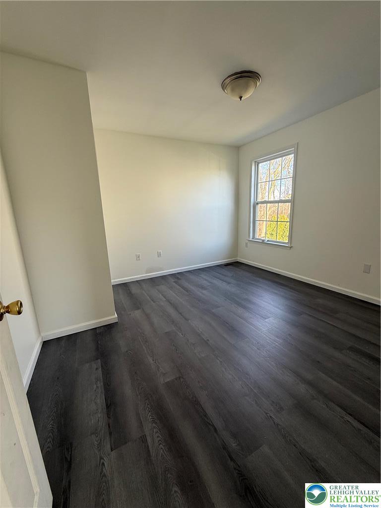 4141 Walter Road Bethlehem, PA 18020 - Photo 18 of 34 an empty room with wooden floor and windows