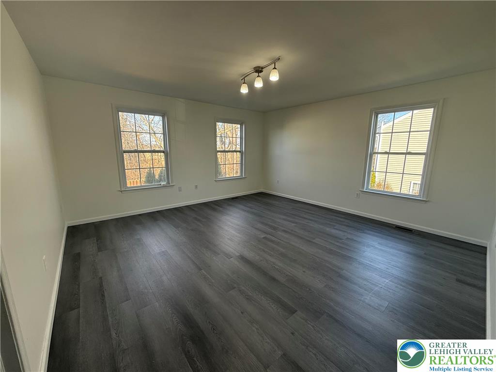 4141 Walter Road Bethlehem, PA 18020 - Photo 21 of 34 an empty room with wooden floor and windows