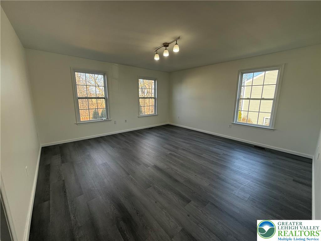 4141 Walter Road Bethlehem, PA 18020 - Photo 22 of 34 an empty room with wooden floor and windows
