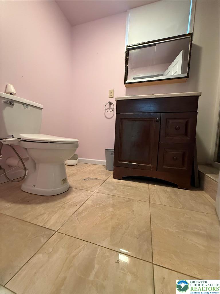 4141 Walter Road Bethlehem, PA 18020 - Photo 31 of 34 a bathroom with a toilet sink and mirror
