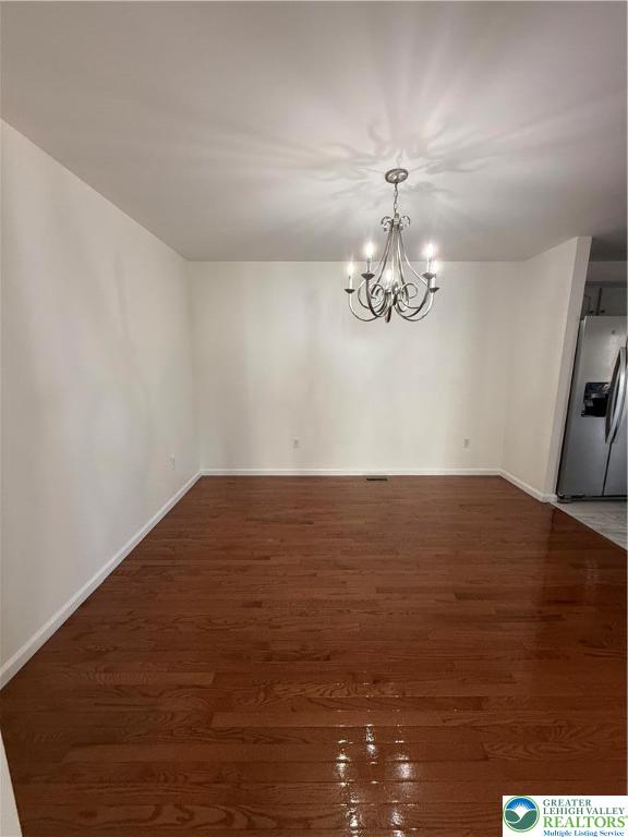 4141 Walter Road Bethlehem, PA 18020 - Photo 32 of 34 a view of a chandelier fan and wooden floor