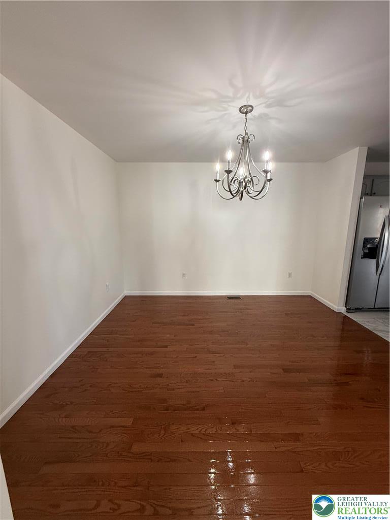 4141 Walter Road Bethlehem, PA 18020 - Photo 32 of 34 a view of a room with wooden floor and chandelier