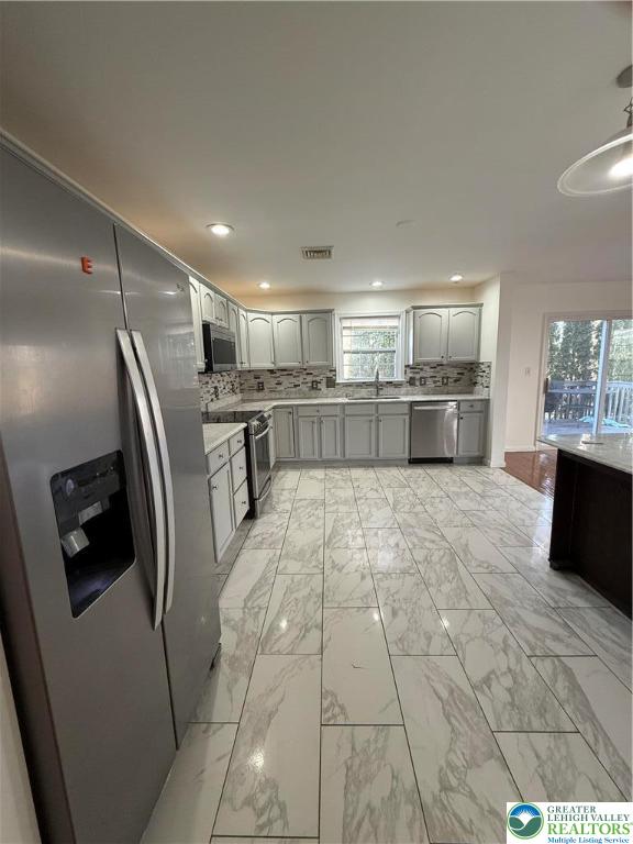 4141 Walter Road Bethlehem, PA 18020 - Photo 6 of 34 a large kitchen with kitchen island a large counter top stainless steel appliances and cabinets