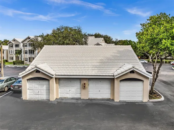 a front view of a house with a garage