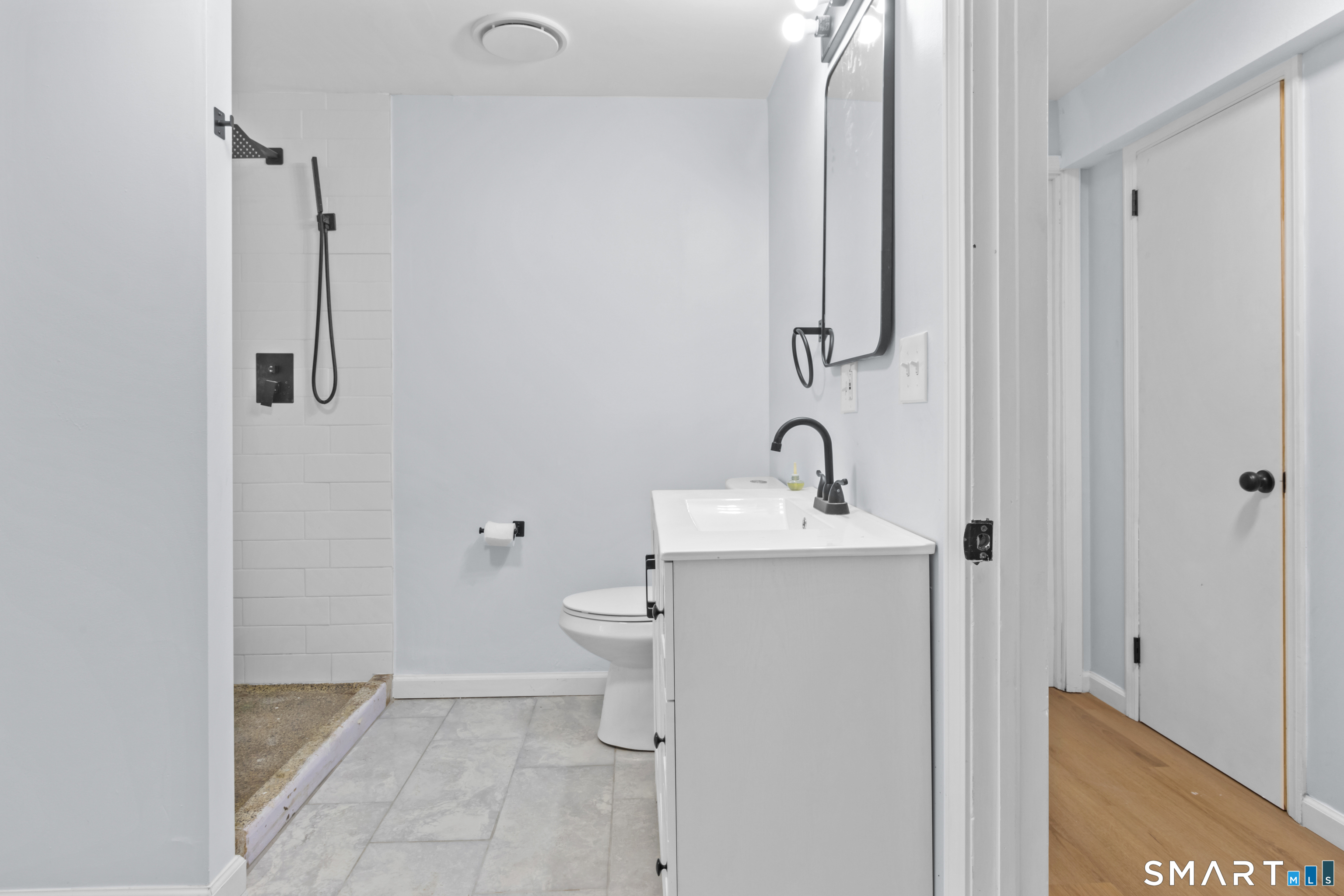 20 Quiet Woods Road East Hampton, CT 06424 - Photo 30 of 40 a bathroom with a toilet sink and mirror