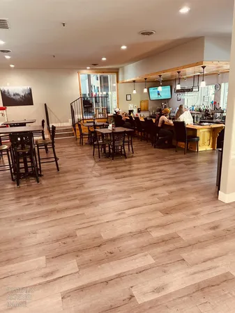 a view of a dining room with furniture window and outside view