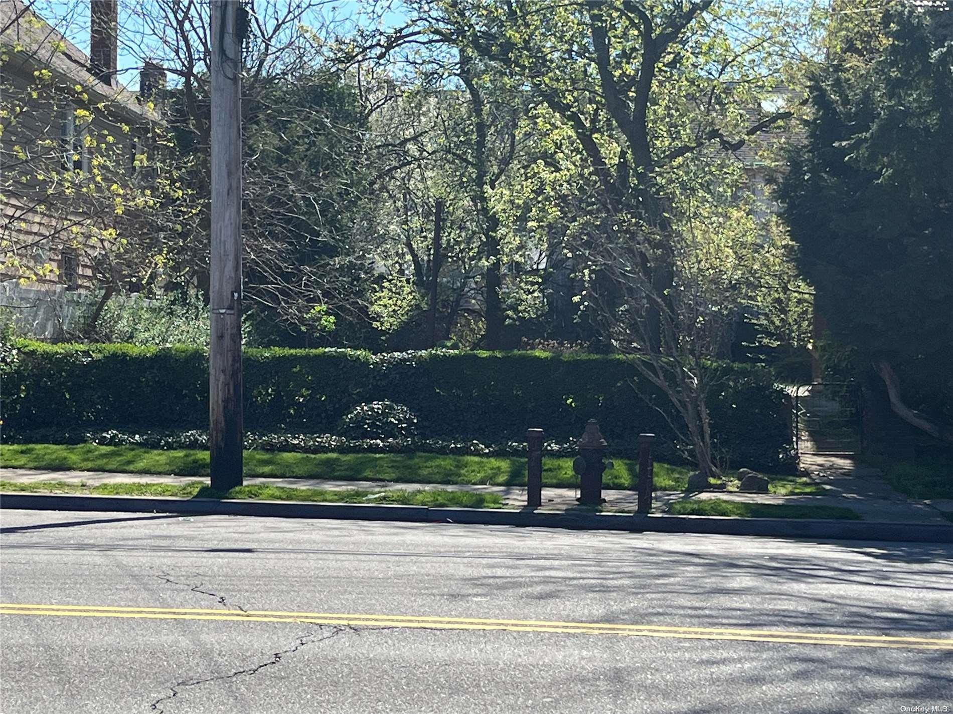 Ditmars Boulevard Manhattan, NY 10029 - Photo 8 of 8 front view of a house with a yard