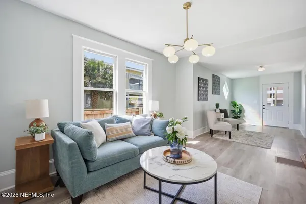 a view of balcony with two couches and potted plants