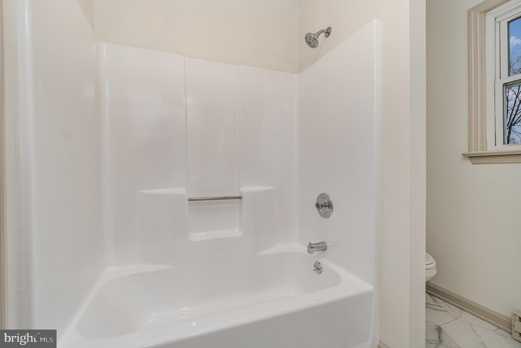 1638 Chadwick Circle Lancaster, PA 17603 - Photo 18 of 25 a white bath tub sitting next to a white sink and vanity