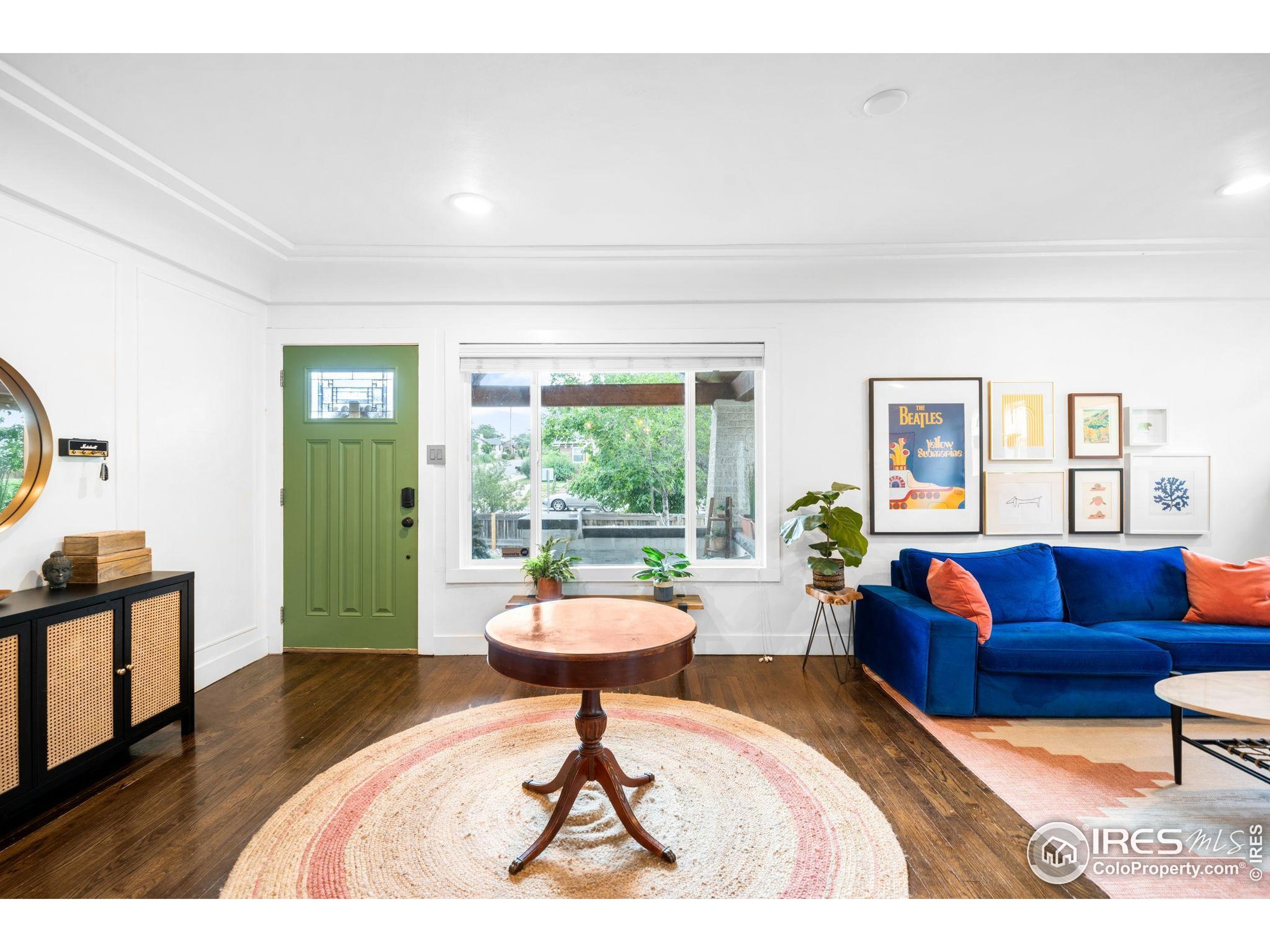 3359 Steele Street Denver, CO 80205 - Photo 12 of 48 a living room with furniture and a large window