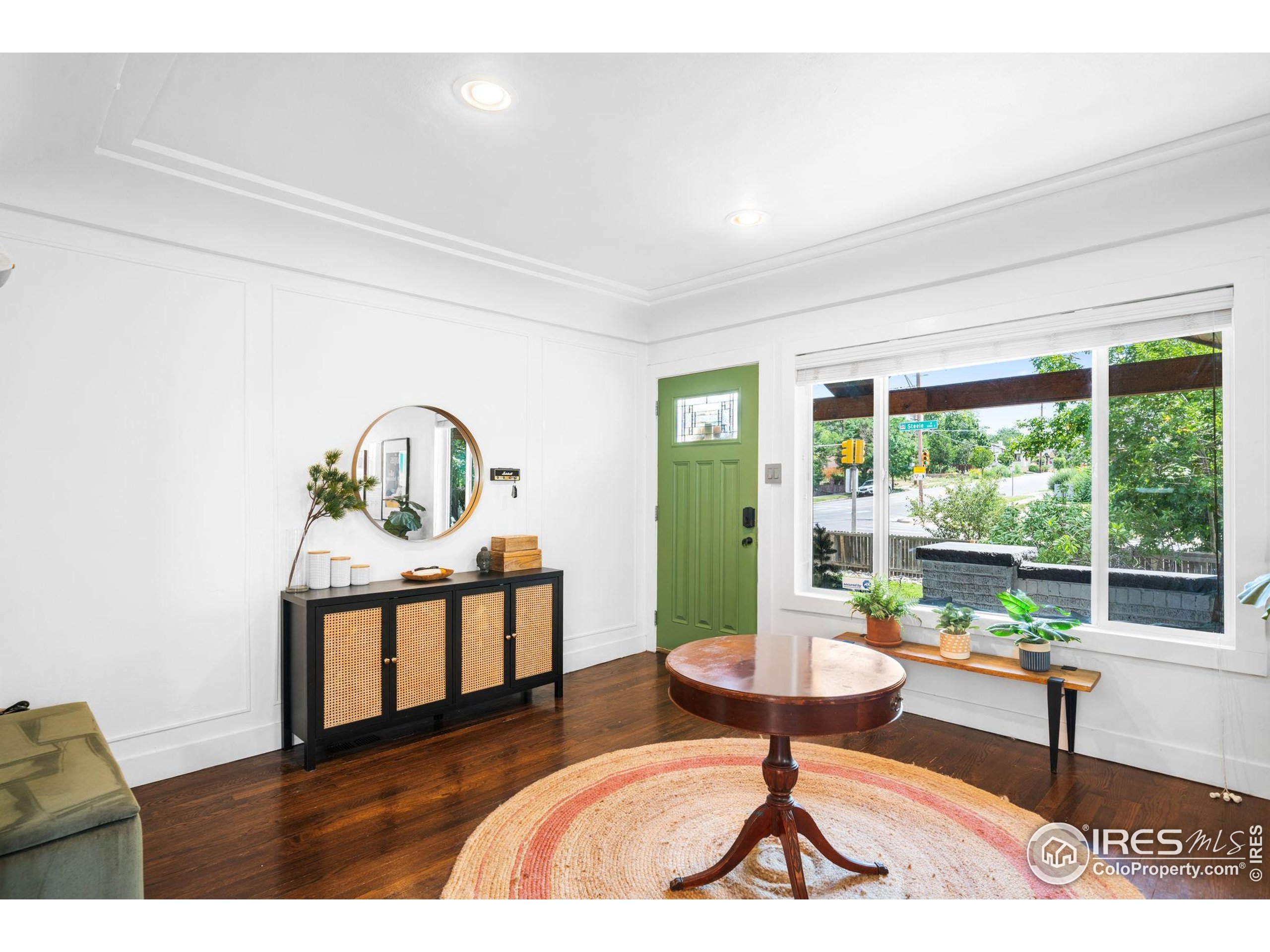 3359 Steele Street Denver, CO 80205 - Photo 13 of 48 a living room with furniture a window and a table