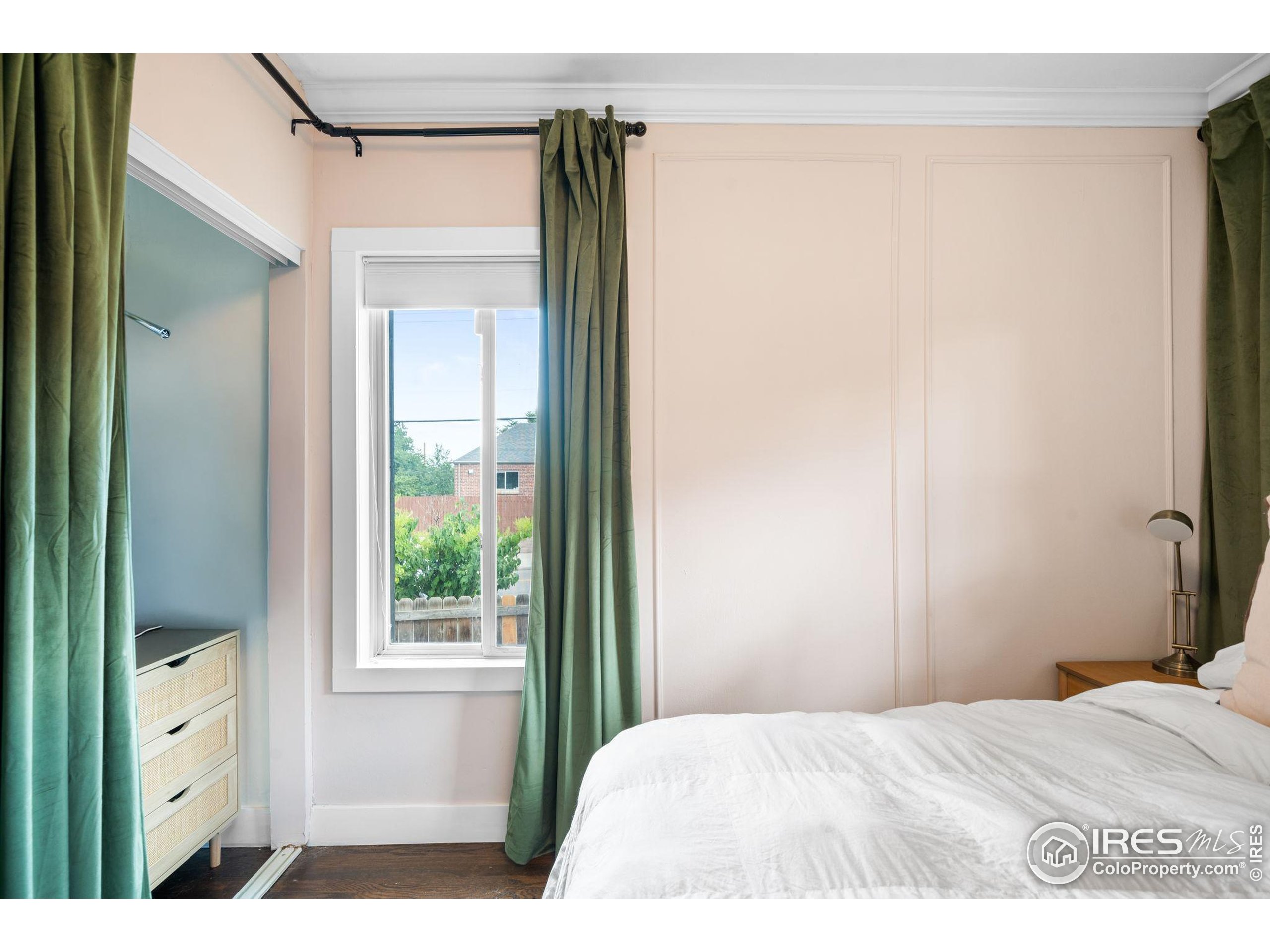 3359 Steele Street Denver, CO 80205 - Photo 15 of 48 a bedroom with a bed and a window