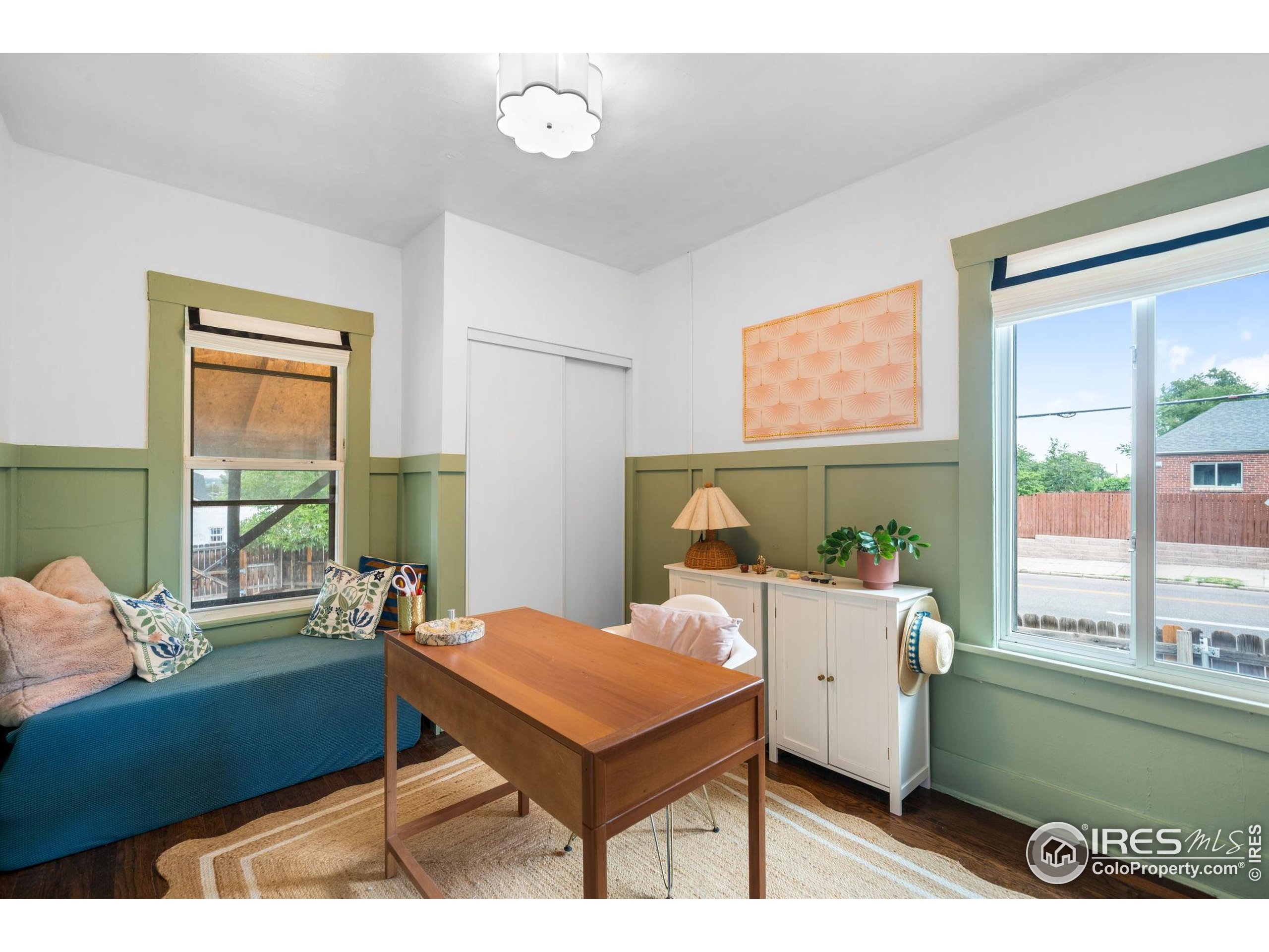 3359 Steele Street Denver, CO 80205 - Photo 19 of 48 a living room with furniture and a large window