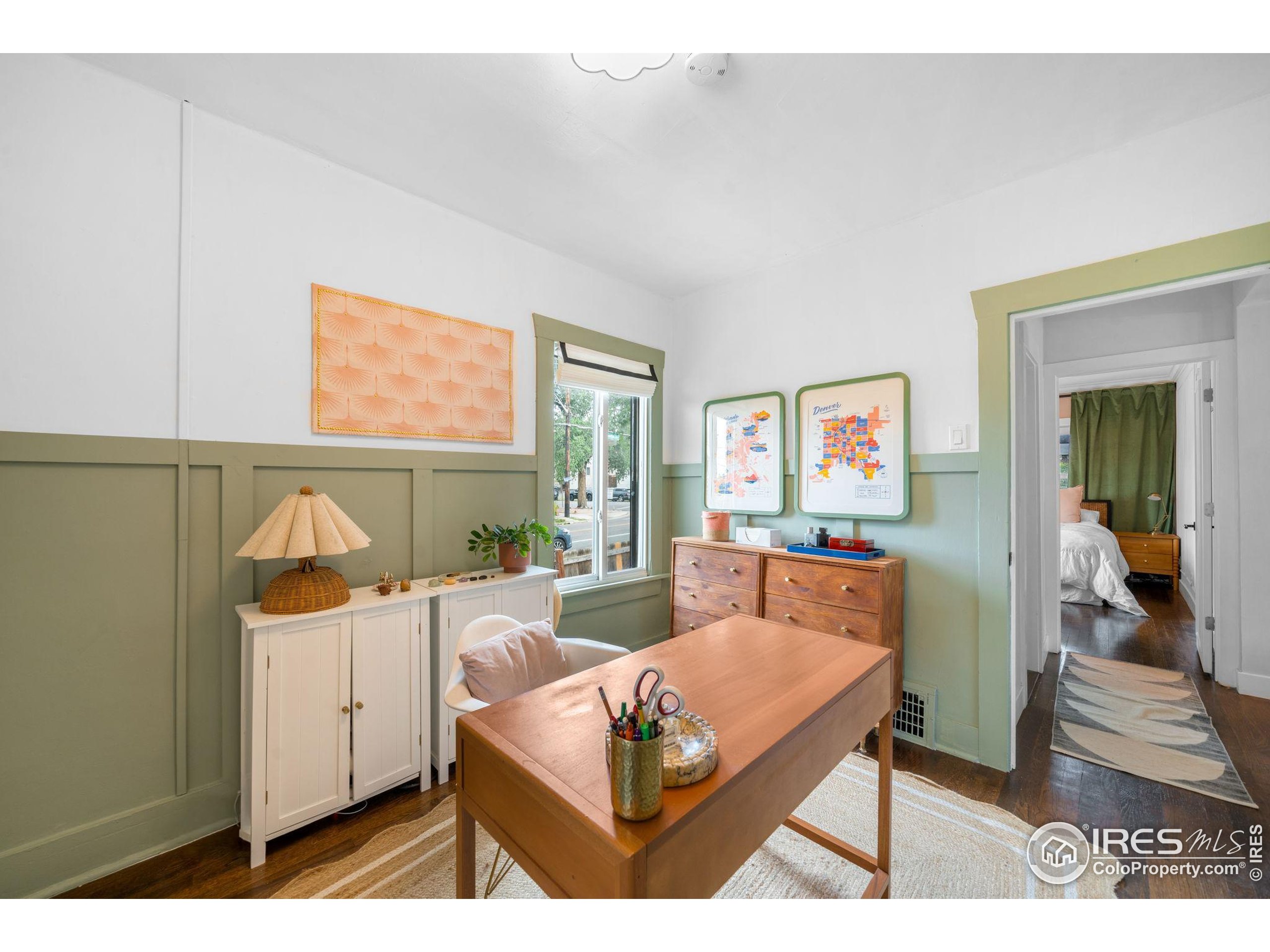 3359 Steele Street Denver, CO 80205 - Photo 20 of 48 a living room with furniture and a flat screen tv