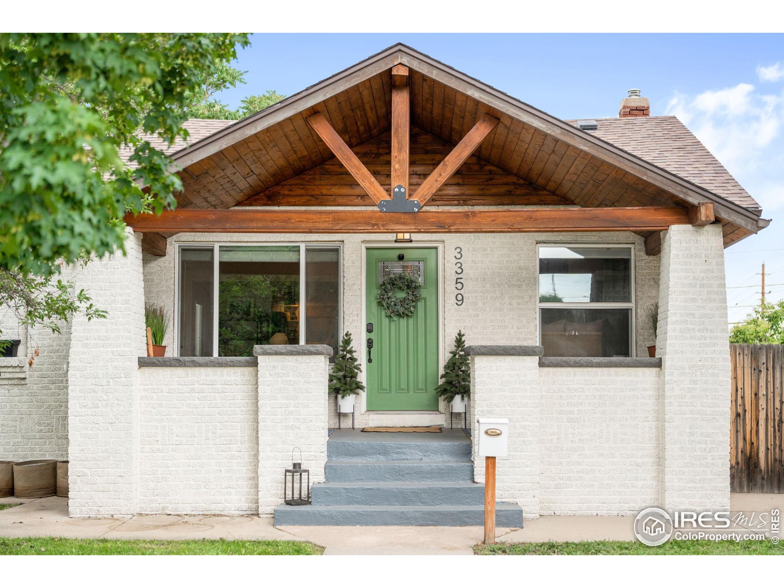 3359 Steele Street Denver, CO 80205 - Photo 30 of 48 a view of house with wooden stairs