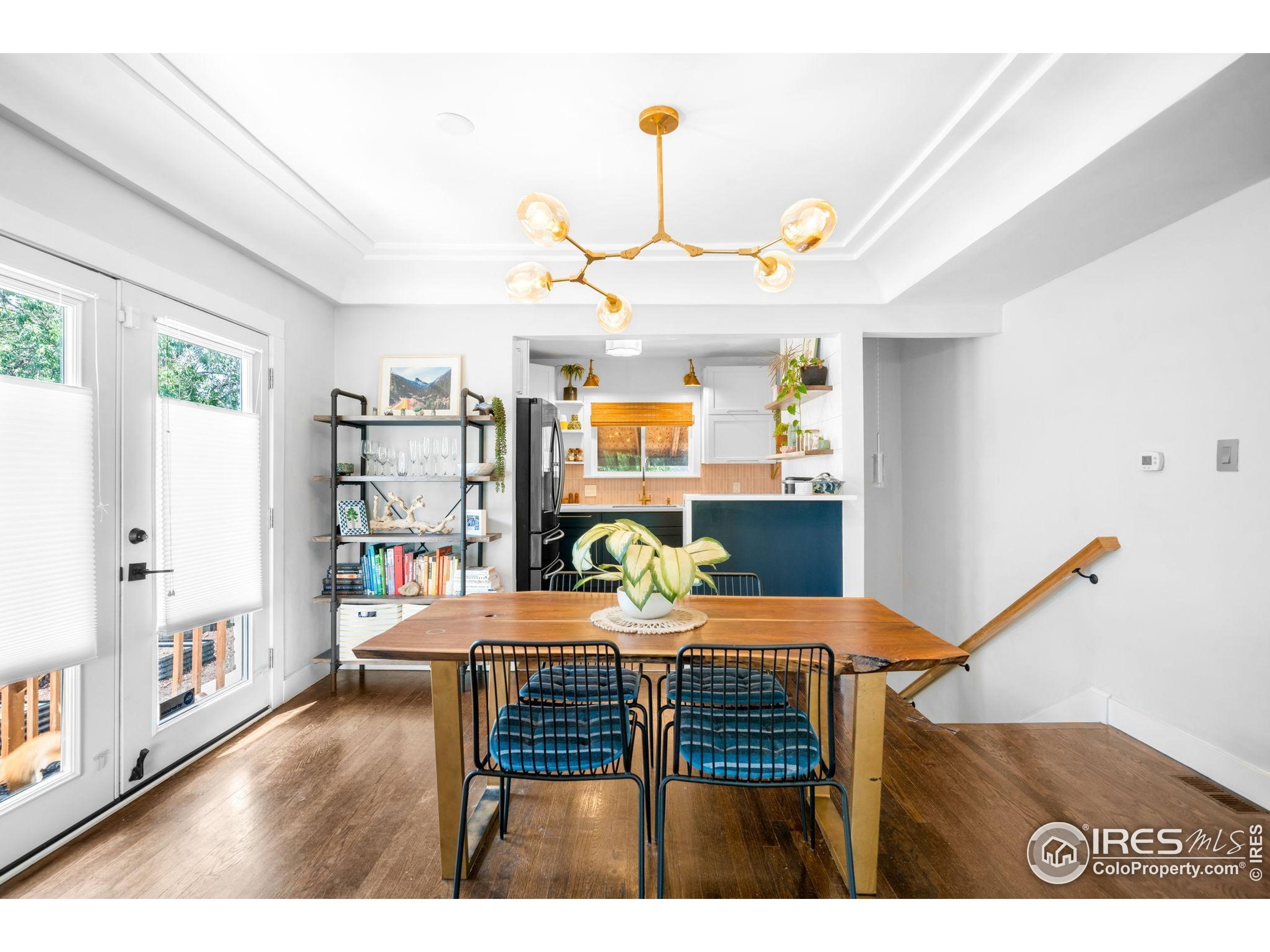 3359 Steele Street Denver, CO 80205 - Photo 3 of 48 a dining room with furniture and wooden floor