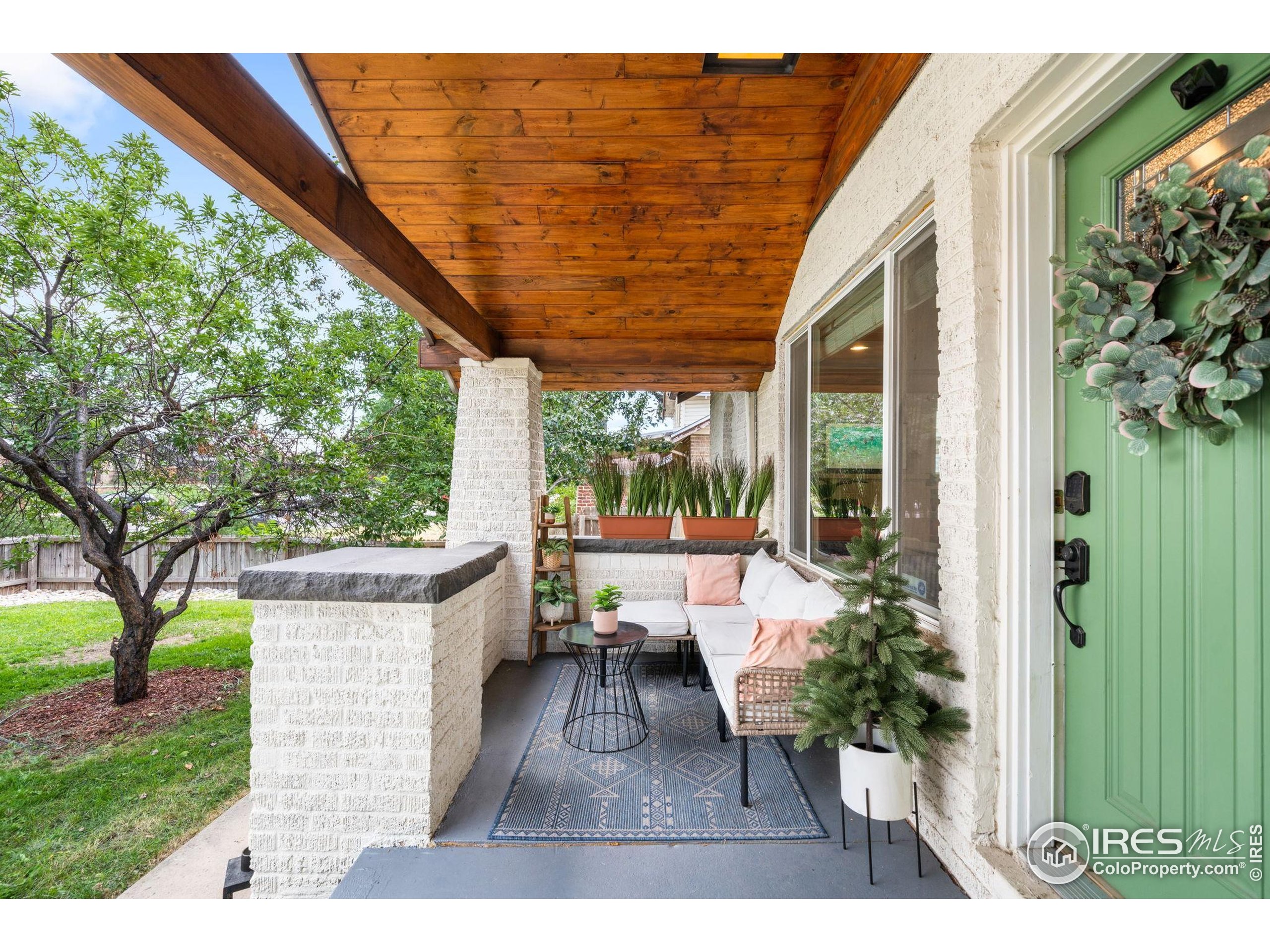 3359 Steele Street Denver, CO 80205 - Photo 31 of 48 a living room with furniture and a large window