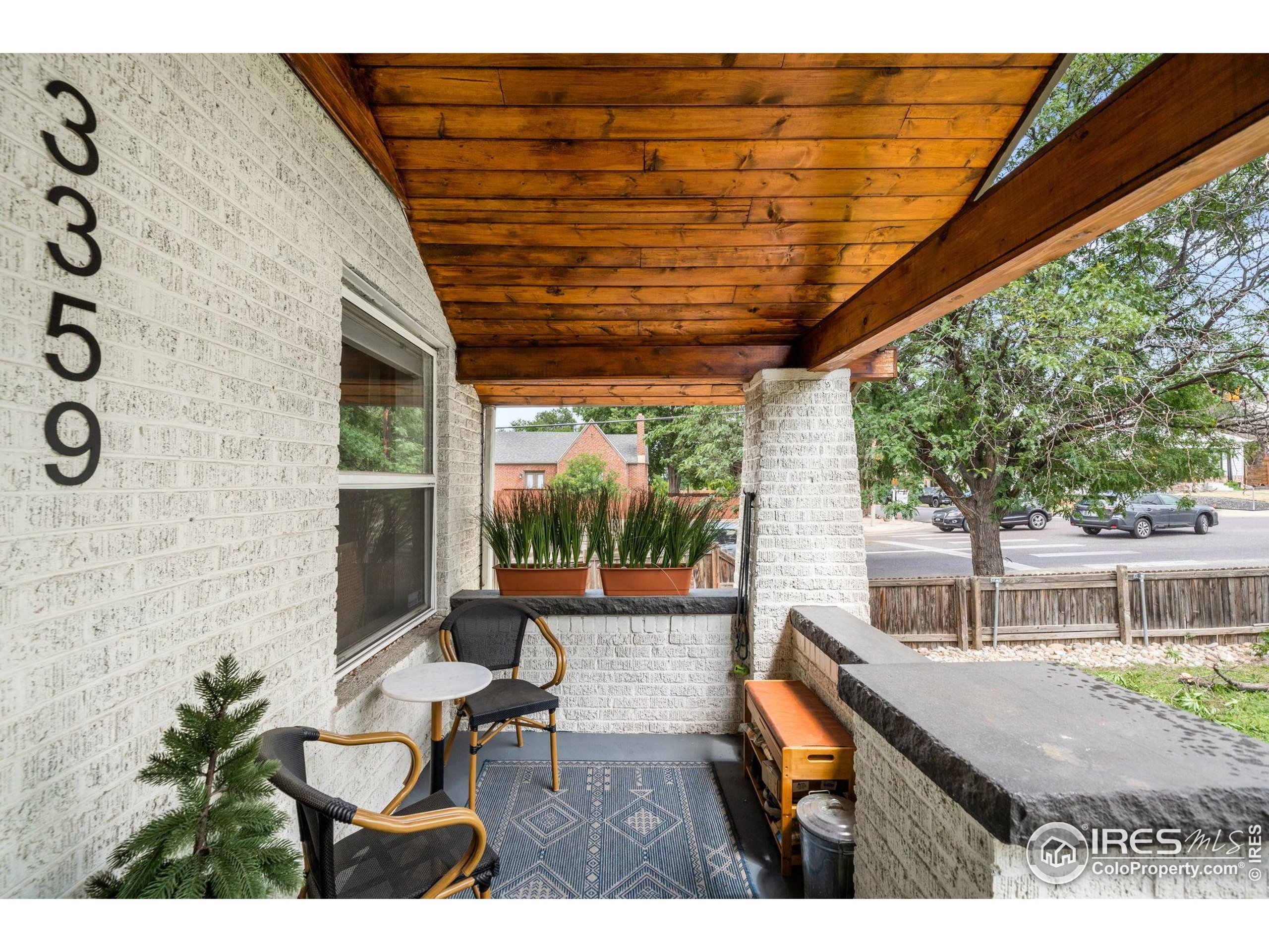 3359 Steele Street Denver, CO 80205 - Photo 32 of 48 a balcony with table and chairs