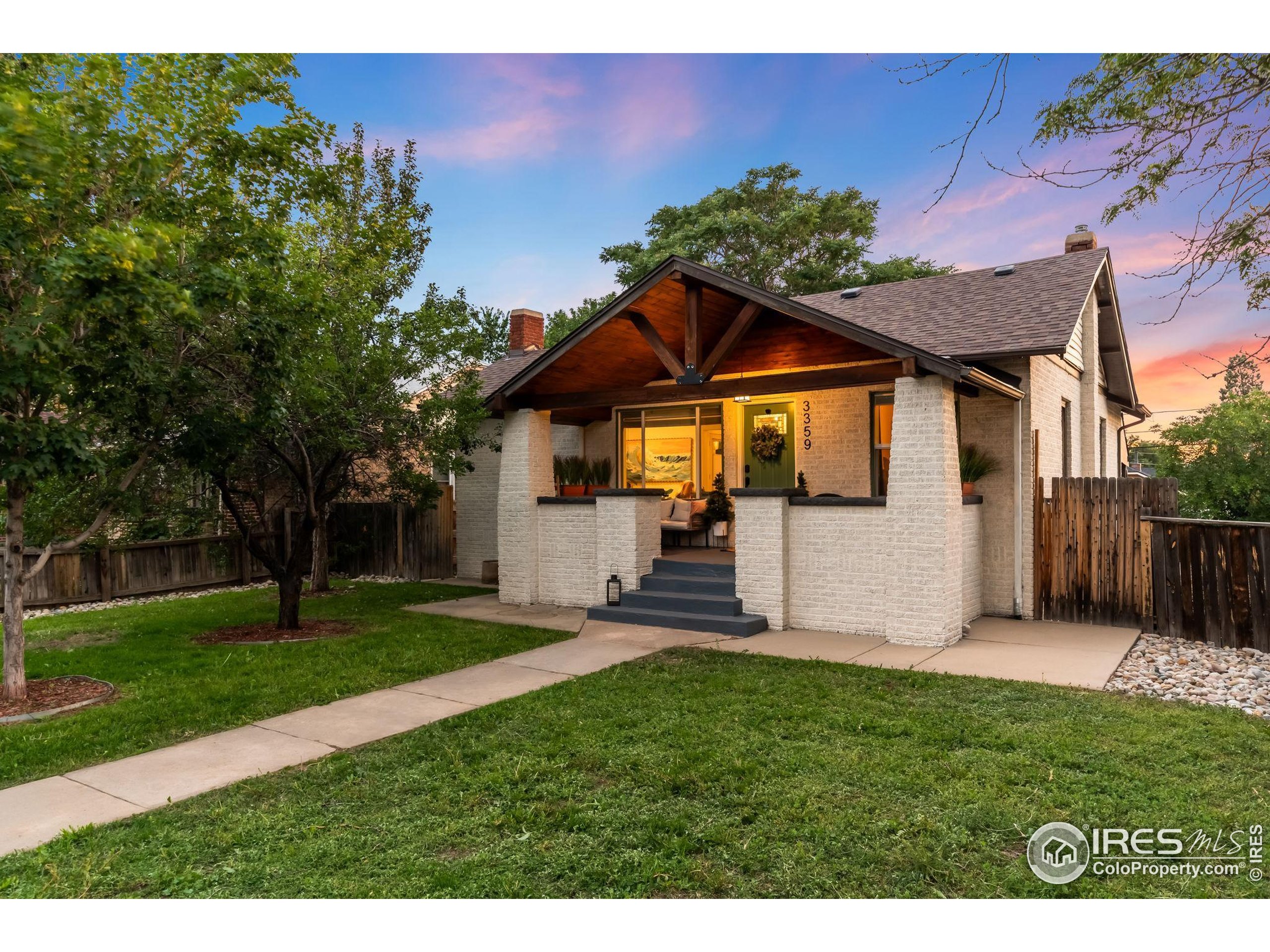 3359 Steele Street Denver, CO 80205 - Photo 34 of 48 a front view of a house with a yard