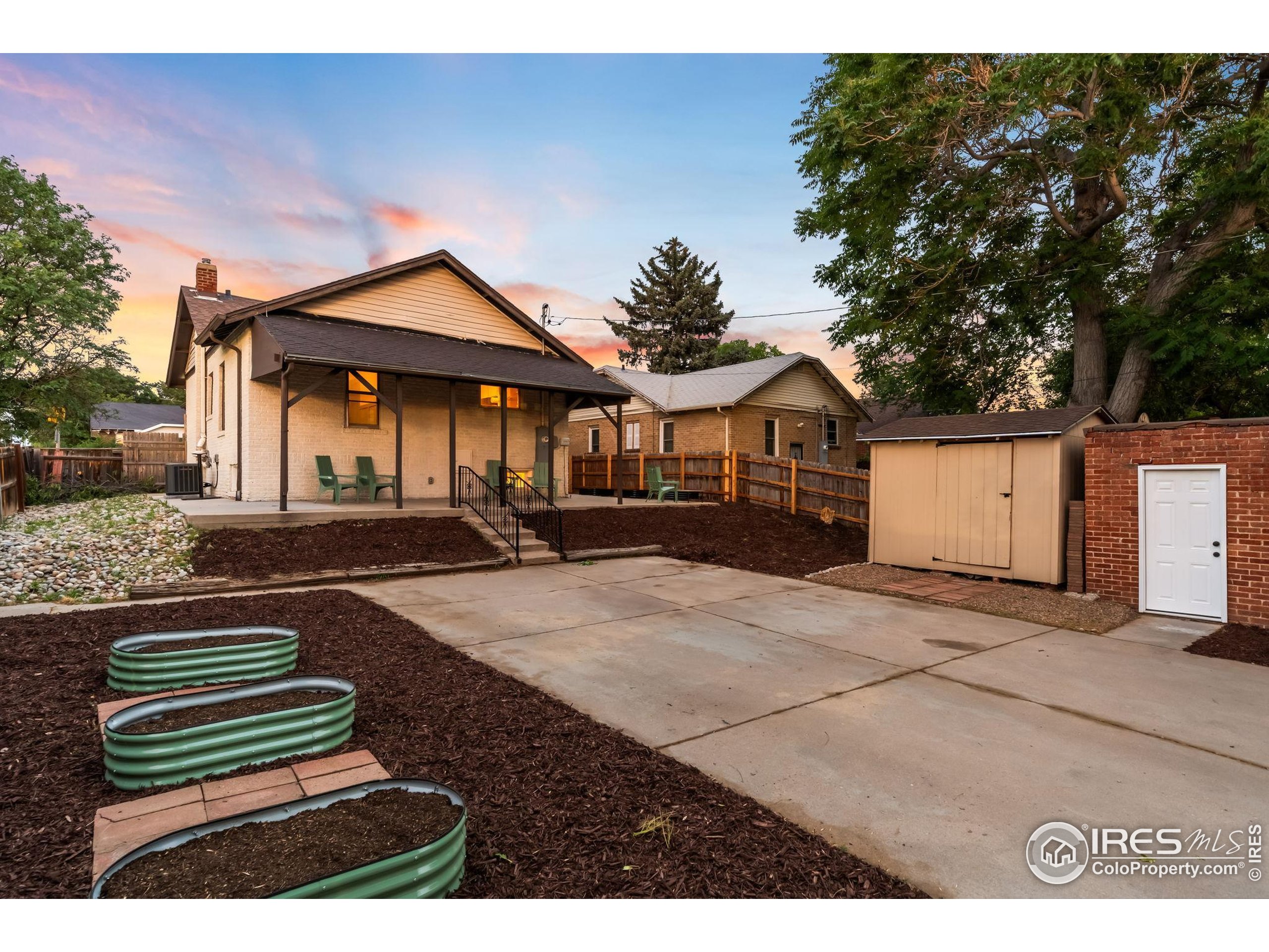 3359 Steele Street Denver, CO 80205 - Photo 36 of 48 a front view of a house with a yard