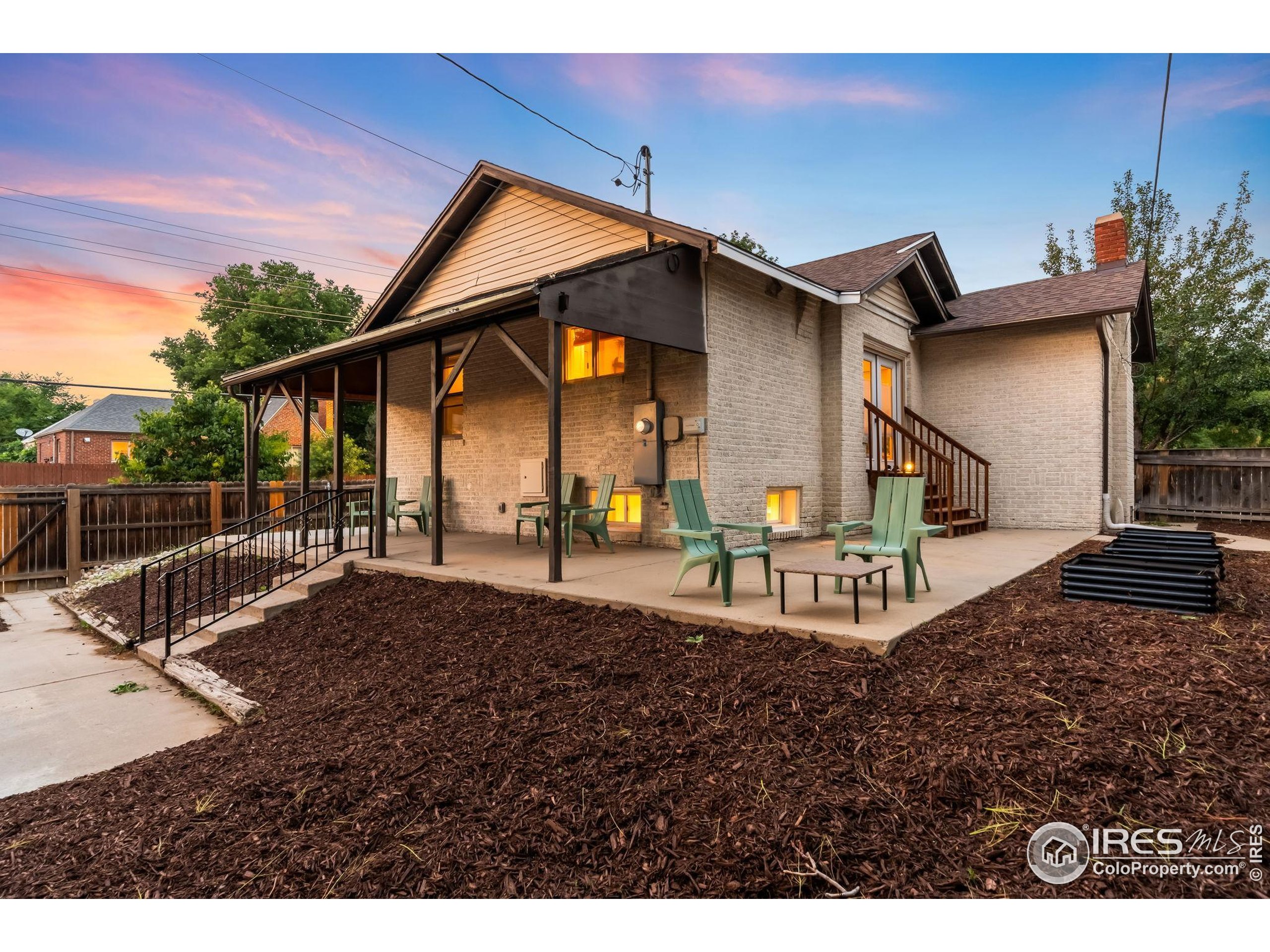 3359 Steele Street Denver, CO 80205 - Photo 39 of 48 a view of a house with backyard and porch