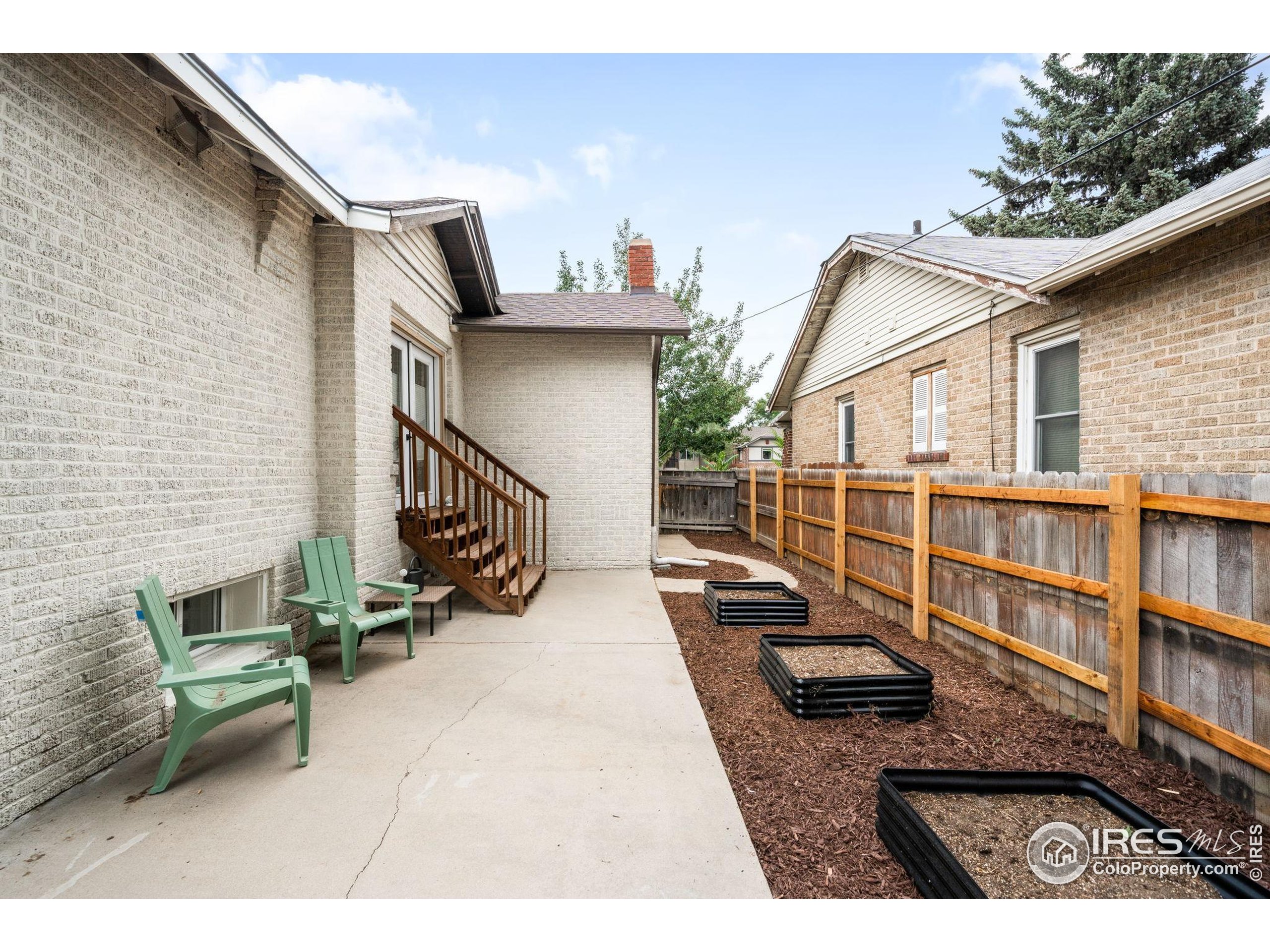 3359 Steele Street Denver, CO 80205 - Photo 41 of 48 a view of house with deck and outdoor seating