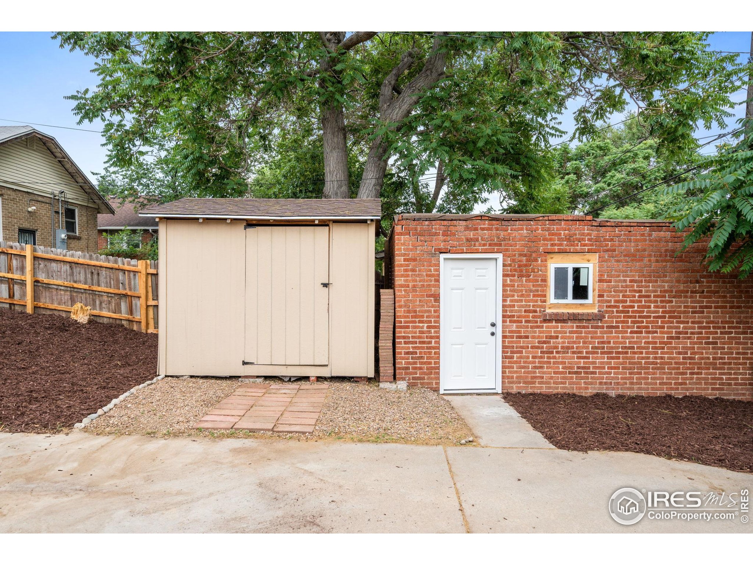 3359 Steele Street Denver, CO 80205 - Photo 42 of 48 a view of a house with a backyard