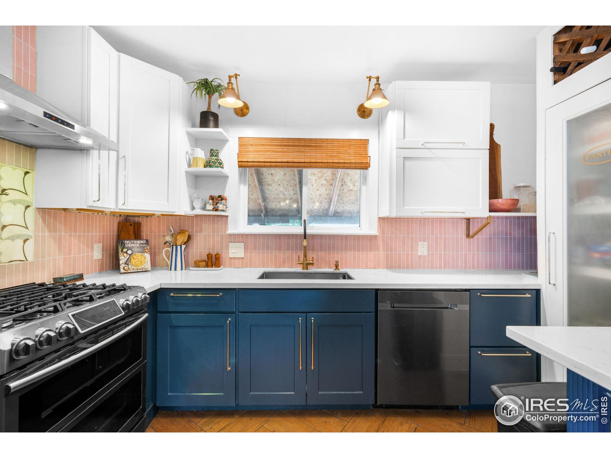 3359 Steele Street Denver, CO 80205 - Photo 6 of 48 a kitchen with a sink and a stove