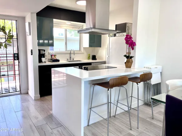 a kitchen with stainless steel appliances a sink and cabinets