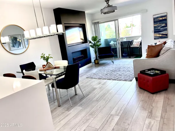 a living room with furniture and a large window