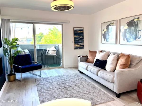 a living room with furniture and a large window