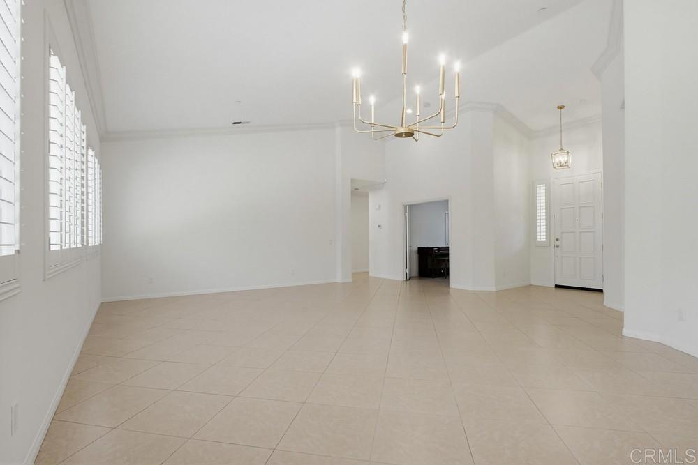 672 Inverlochy Drive Fallbrook, CA 92028 - Photo 14 of 75 an empty room with windows and fireplace