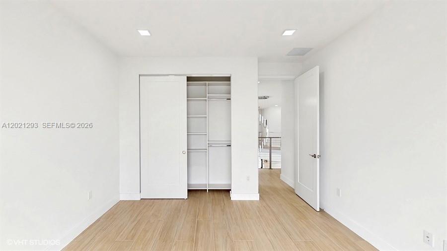 8350 Royal County Down Road Boca Raton, FL 33434 - Photo 29 of 52 a view of hallway with wooden floor