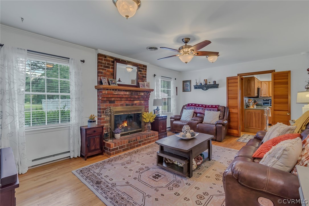 31 Bunker Hill Road Farnham, VA 22460 - Photo 11 of 47 a living room with furniture a fireplace and a window