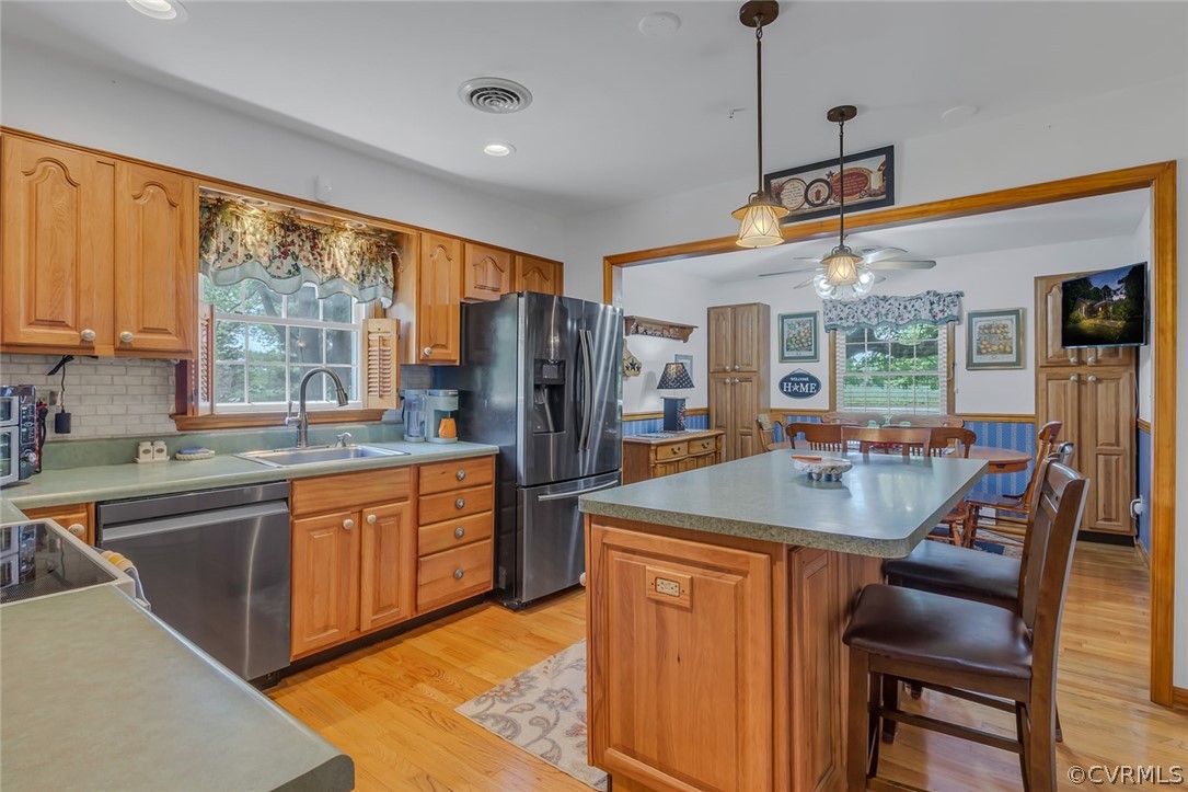 31 Bunker Hill Road Farnham, VA 22460 - Photo 16 of 47 a kitchen with stainless steel appliances granite countertop a sink and a refrigerator