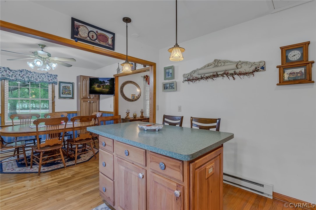 31 Bunker Hill Road Farnham, VA 22460 - Photo 17 of 47 a view of a kitchen with a table and a clock on the wall