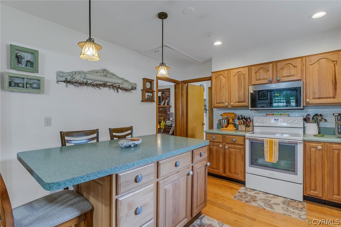 31 Bunker Hill Road Farnham, VA 22460 - Photo 18 of 47 a kitchen with stainless steel appliances granite countertop a sink a stove a refrigerator cabinets and chairs