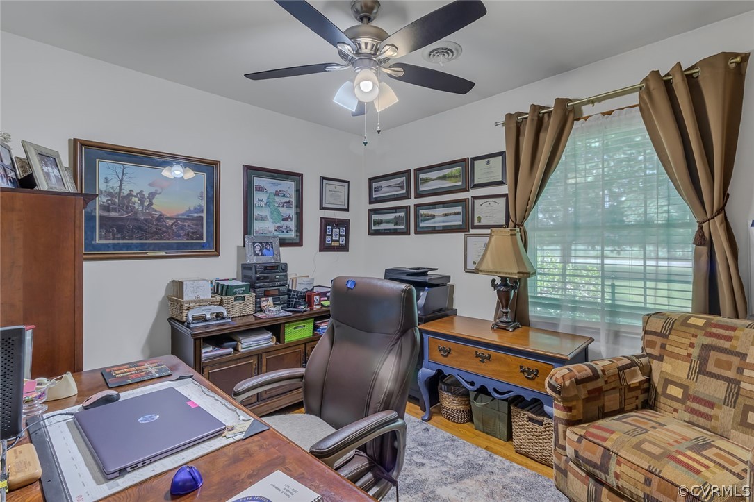 31 Bunker Hill Road Farnham, VA 22460 - Photo 22 of 47 a living room with furniture a flat screen tv and a window
