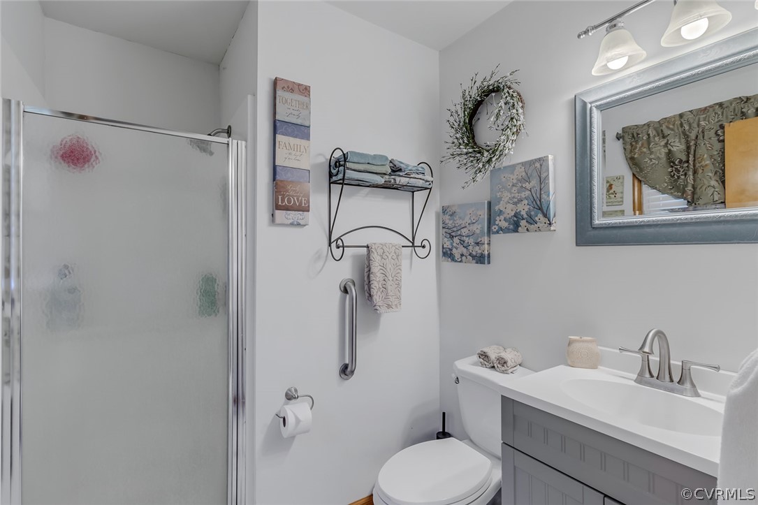 31 Bunker Hill Road Farnham, VA 22460 - Photo 26 of 47 a bathroom with a sink toilet and shower