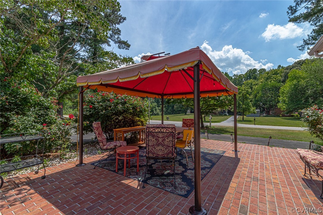 31 Bunker Hill Road Farnham, VA 22460 - Photo 36 of 47 a view of a patio with a table chairs and a yard