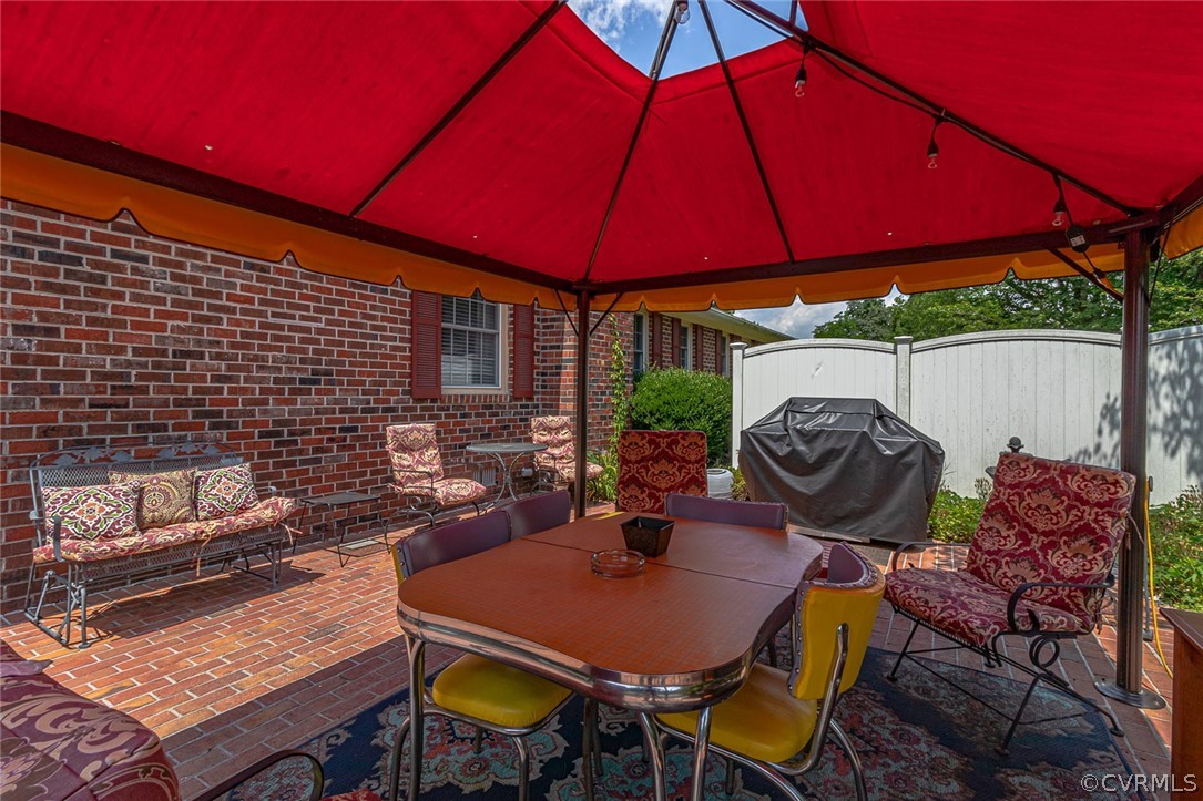 31 Bunker Hill Road Farnham, VA 22460 - Photo 38 of 47 a view of a backyard with table and chairs under an umbrella