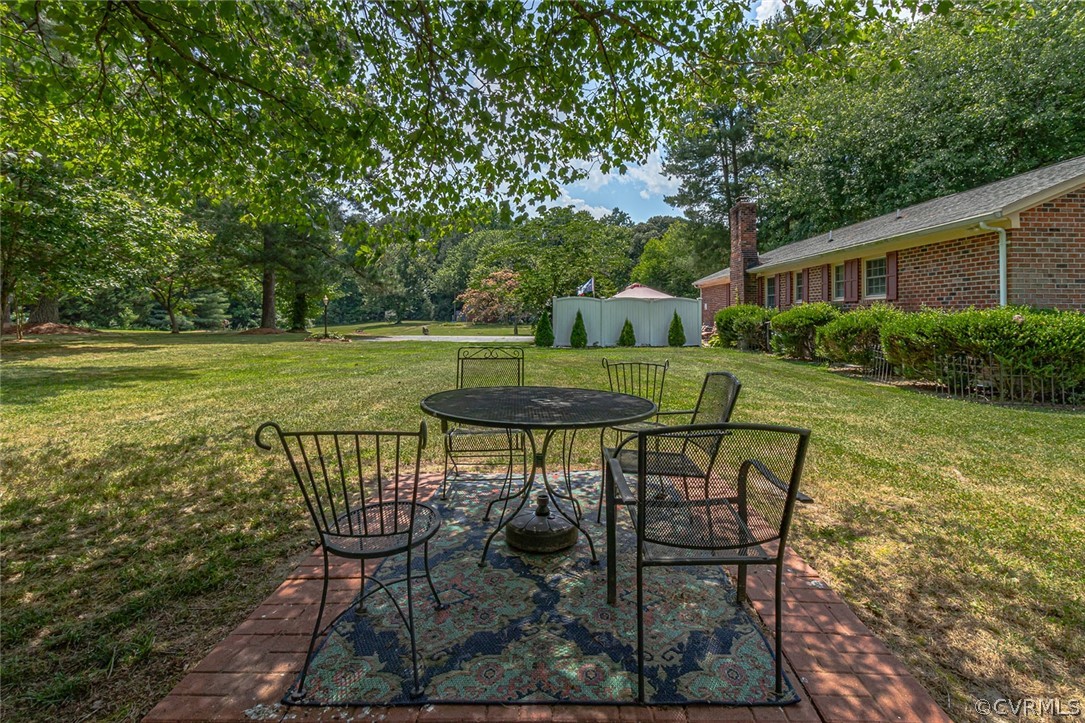 31 Bunker Hill Road Farnham, VA 22460 - Photo 46 of 47 a view of a table and chairs in backyard of the house