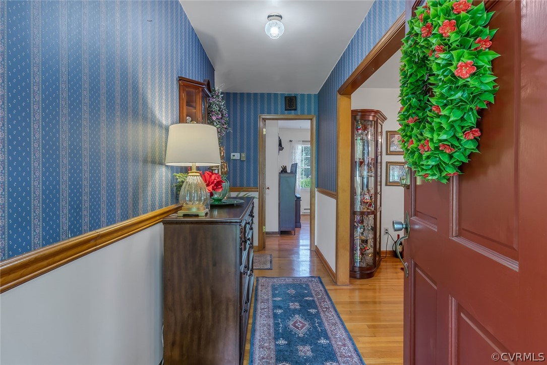 31 Bunker Hill Road Farnham, VA 22460 - Photo 6 of 47 a hallway with flower plants and wooden floor