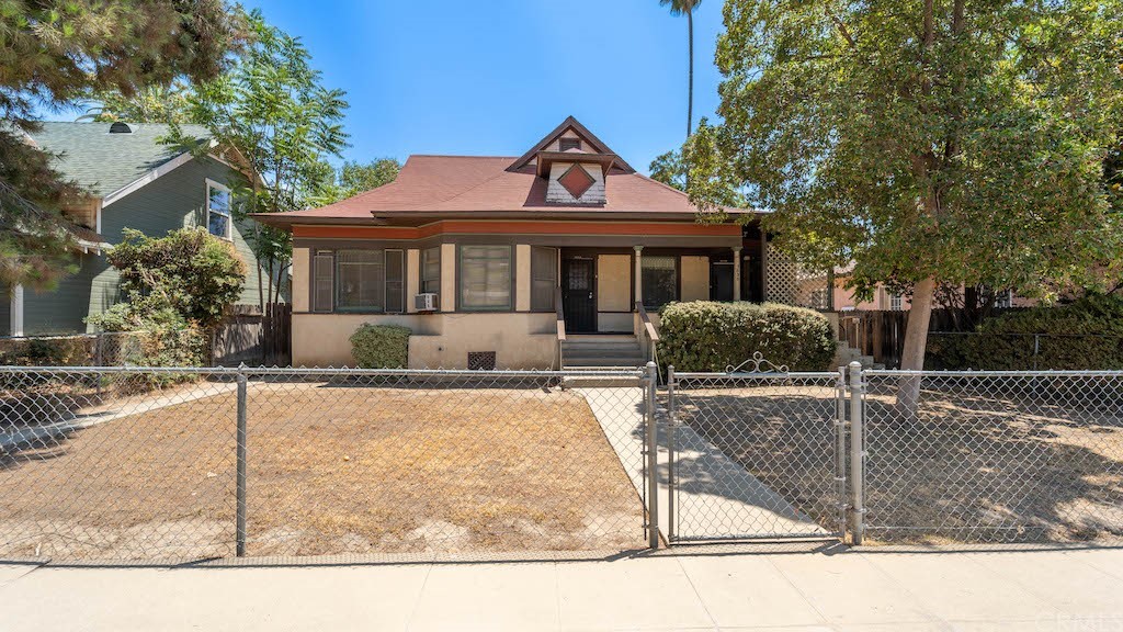 3624 Locust Street Riverside, CA 92501 - Photo 1 of 1 a front view of a house with garden