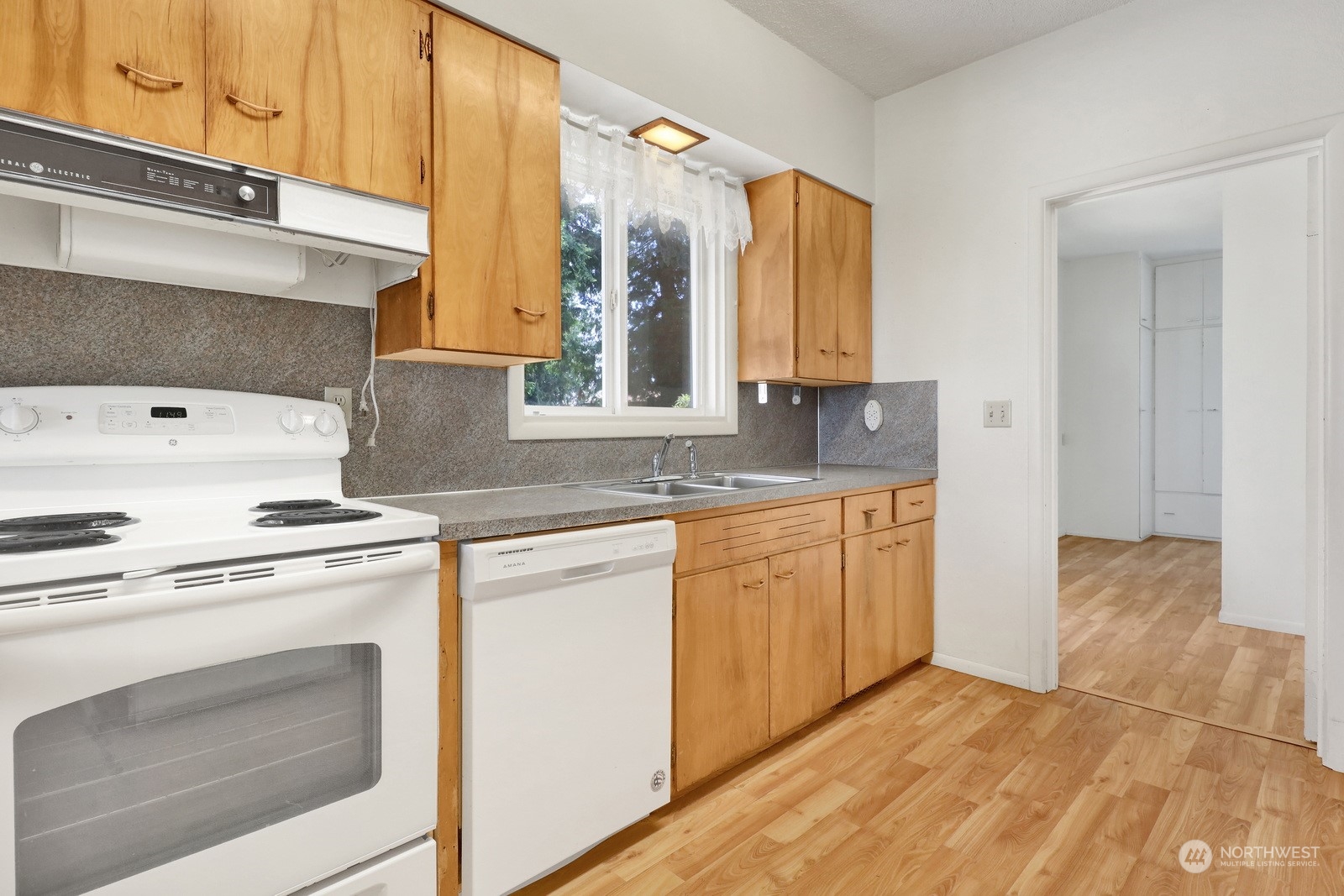 1705 Pangborn Road Lynden, WA 98264 - Photo 11 of 40 a kitchen with granite countertop white cabinets and white appliances